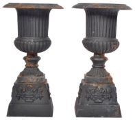 PAIR OF ANTIQUE CAST IRON EBONISED CAMPANA GARDEN URNS