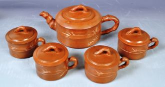 CHINESE ORIENTAL YIXING RED CLAY TEAPOT AND FOUR CUPS WITH COVERS