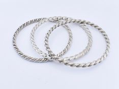 WOLFERS - THREE MID CENTURY SILVER BANGLES