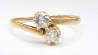 GOLD AND DIAMOND TWO STONE CORSSOVER RING