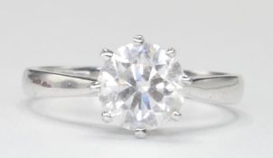 18CT WHITE GOLD AND DIAMOND SOLITAIRE RING