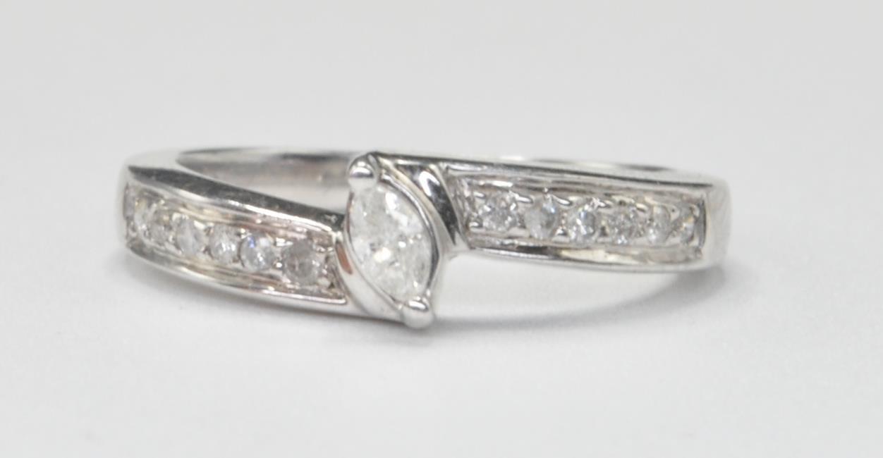 WHITE GOLD AND DIAMOND CROSSOVER RING