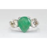 18CT WHITE GOLD EMERALD AND DIAMOND THREE STONE RING