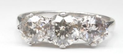 THREE STONE DIAMOND AND WHITE GOLD RING