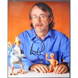 AARDMAN ANIMATIONS - PETER LORD - AUTOGRAPHED 8X10" COLOUR PHOTO