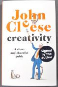 JOHN CLEESE - FAWLTY TOWERS - AUTOGRAPHED CREATIVITY BOOK