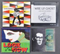 ELVIS COSTELLO - COLLECTION OF X4 AUTOGRAPHED ALBUM ITEMS
