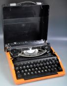 SILVER SEIKO DESK TOP TRAVEL TYPEWRITER IN AN ORANGE COLOURWAY