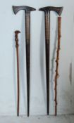 GROUP OF 20TH CENTURY CARVED WOOD WALKING STICKS.