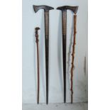 GROUP OF 20TH CENTURY CARVED WOOD WALKING STICKS.