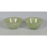 TWO CHINESE ORIENTAL GREEN JADE COLOURED RICE BOWLS.