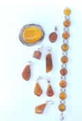 GROUP OF SILVER AND AMBER JEWELLERY