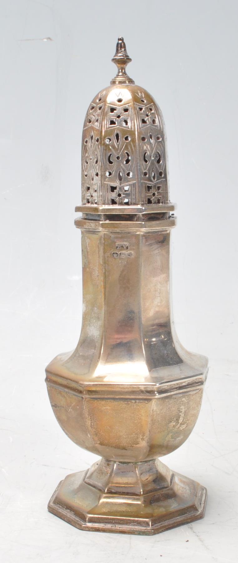 An early 20th century circa 1930’s silver sugar sifter / shaker of a baluster form with pierced led,