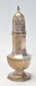 An early 20th century circa 1930’s silver sugar sifter / shaker of a baluster form with pierced led,