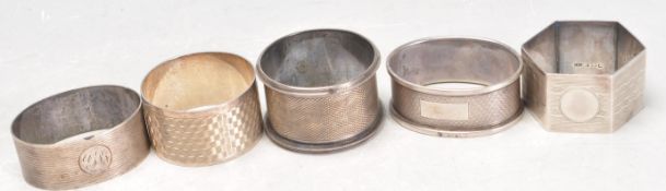 HARLEQUIN SET OF FIVE SILVER NAPKIN RINGS