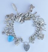 LADIES STAMPED SILVER CHARM BRACELET.