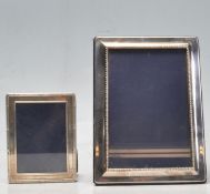 PAIR OF 20TH CENTURY HALLMARKED SILVER PHOTO FRAMES