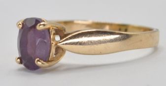 9CT GOLD AND PURPLE STONE RING