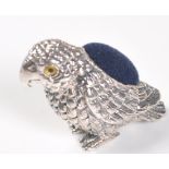 STAMPED STERLING SILVER PARROT PIN CUSHION.