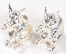 PAIR OF SILVER PLATED CONDIMENT SALT AND PEPPER SHAKERS IN THE FORM OF PIGS.