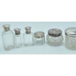 COLLECTION OF SIX ANTIQUE SILVER LIDDED VANITY POTS AND PERFUME BOTTLES.