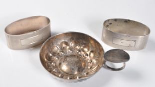 TWO SILVER HALLMARKED NAPKIN RINGS AND A FRENCH TASTEVIN.