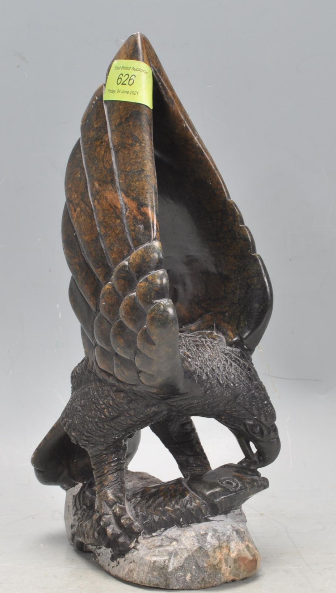 20TH CENTURY CARVED HARDSTONE FIGURE OF A BIRD OF PREY.