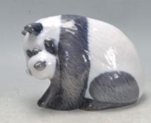 TWO ROYAL COPENHAGEN PANDA AND HOUND FIGURINES