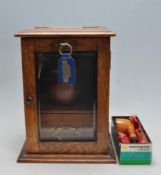 19TH CENTURY VICTORIAN OAK SMOKERS CABINET COMPLETE WITH PIPES, TOBACCO JAR, LIGHTER AND TOOLS