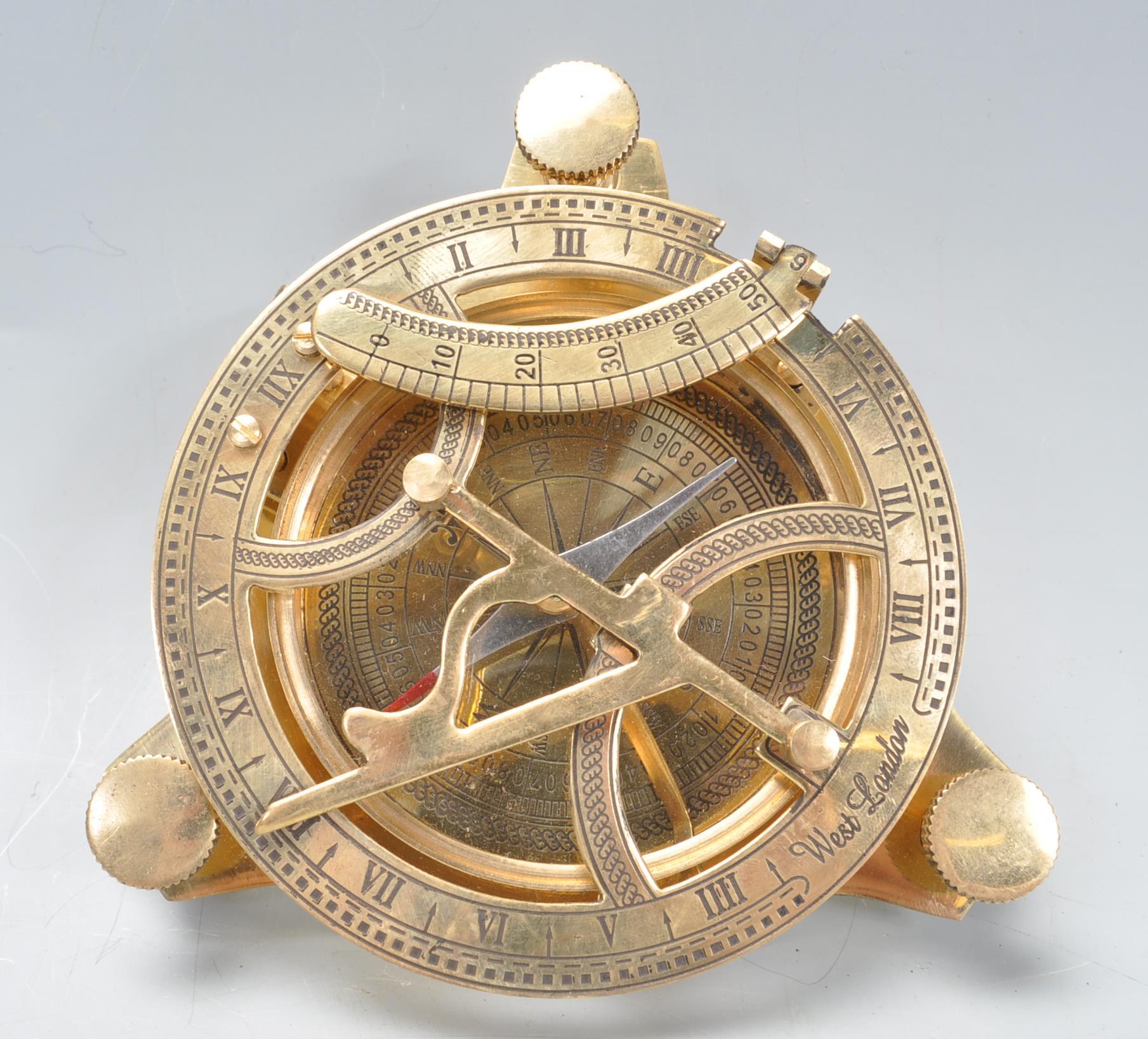 VINTAGE STYLE BRASS TABLE COMPASS AND SUN DIAL.