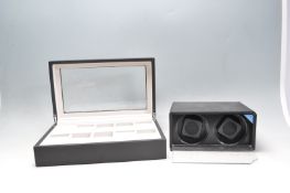 AUTOMATIC DUAL WINDER AND A PRESENTATION BOX