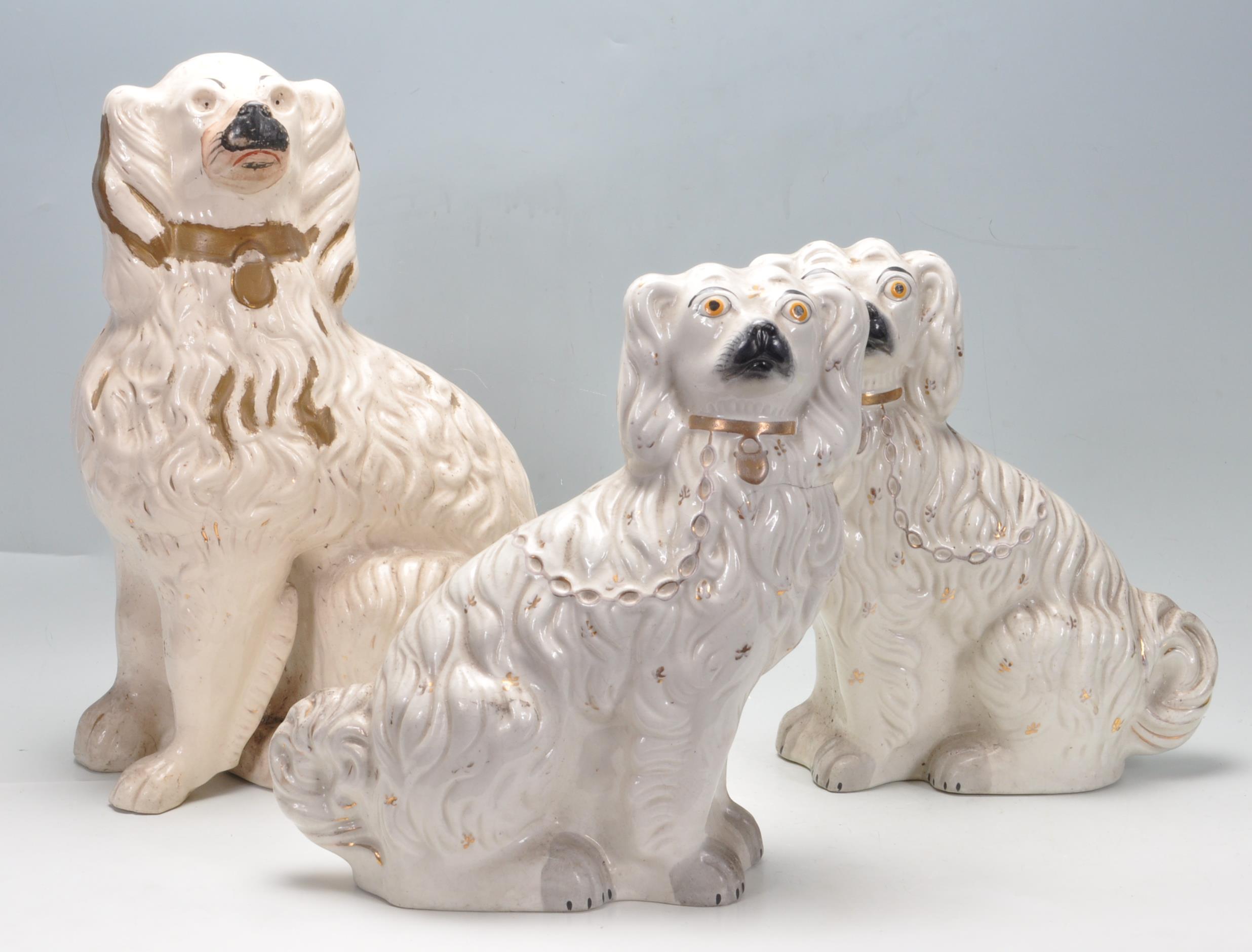 THREE 19TH CENTURY VICTORIAN STAFFORDSHIRE SPANIEL DOGS