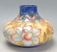 20TH CENTURY VASE IN THE MANNER OF MOORCROFT ORCHIDS.