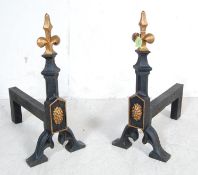 TWO LARGE CAST IRON FIRE SIDE DOGS