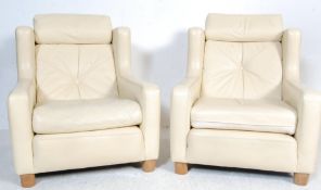 20TH CENTURY DANISH INSPIRED CREAM LEATHER ARMCHAIRS