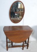 1940’S OAK DROP LEAF DINING TABLE AND OVAL WALL MIRROR