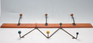 TWO VINTAGE RETRO ATOMIC WALL MOUTHED COAT HOOKS