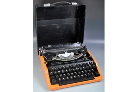 SILVER SEIKO DESK TOP TRAVEL TYPEWRITER IN AN ORANGE COLOURWAY