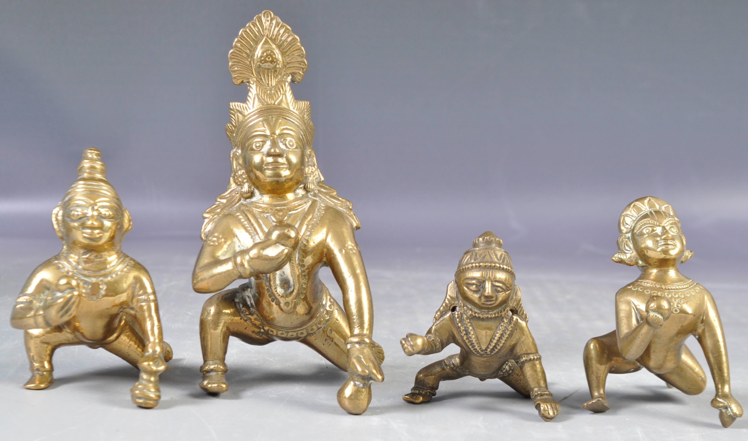 COLLECTION OF ANTIQUE FIGURES OF BOY KRISHNA AND BUTTER BALL