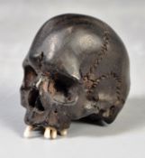 19TH CENTURY JAPANESE MEMENTO MORI EBONISED NETSUKE SKULL