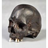 19TH CENTURY JAPANESE MEMENTO MORI EBONISED NETSUKE SKULL