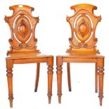 MATCHING PAIR OF VICTORIAN OAK CARVED HALL CHAIRS