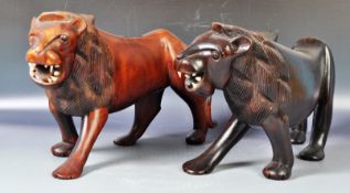 LARGE CARVED PAIR OF ART DECO INFLUENCE AFRICAN HARDWOOD LIONS