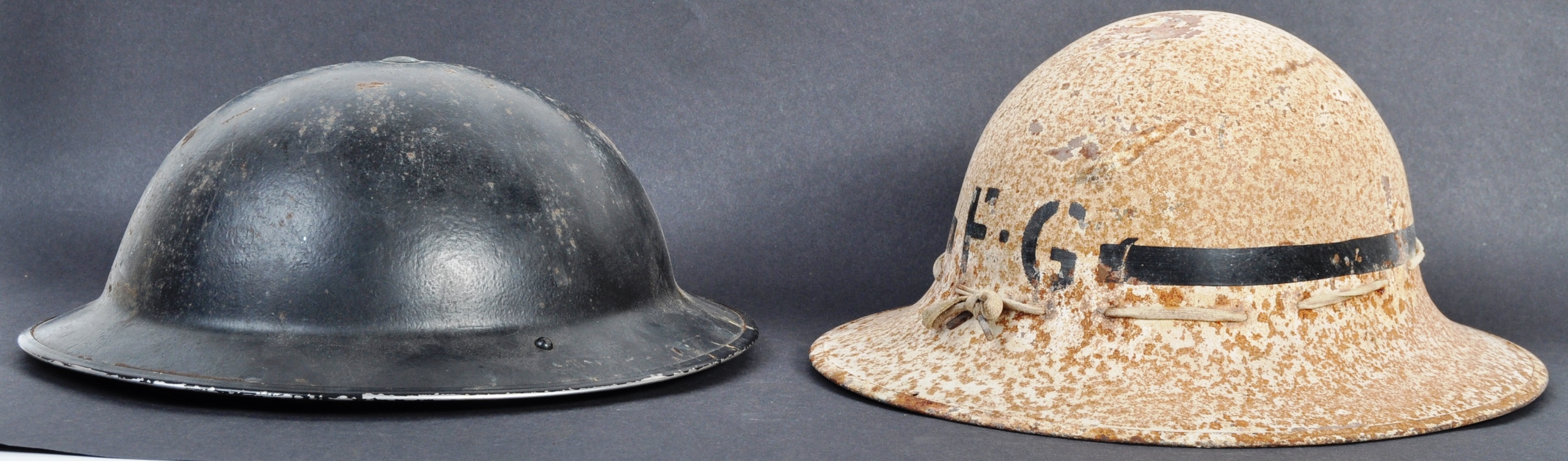 TWO ORIGINAL WWII SECOND WORLD WAR BRITISH COMBAT HELMETS