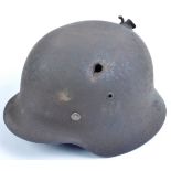 ORIGINAL WWII GERMAN M35 STAHLHELM BATTLE DAMAGED HELMET