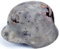 ORIGINAL WWII GERMAN M35 STAHLHELM BATTLE DAMAGED HELMET