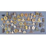 COLLECTION OF ASSORTED WWII AND WWII MILITARY CAP BADGES