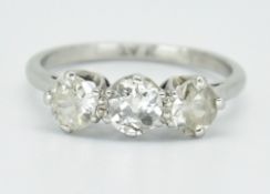 PLATINUM & DIAMOND THREE STONE RING.