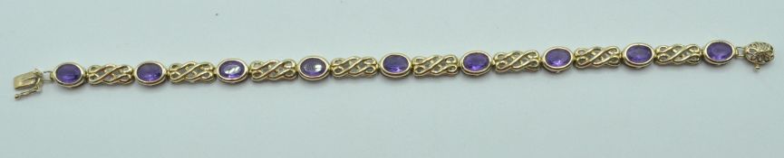 9CT GOLD AND PURPLE STONE BRACELET