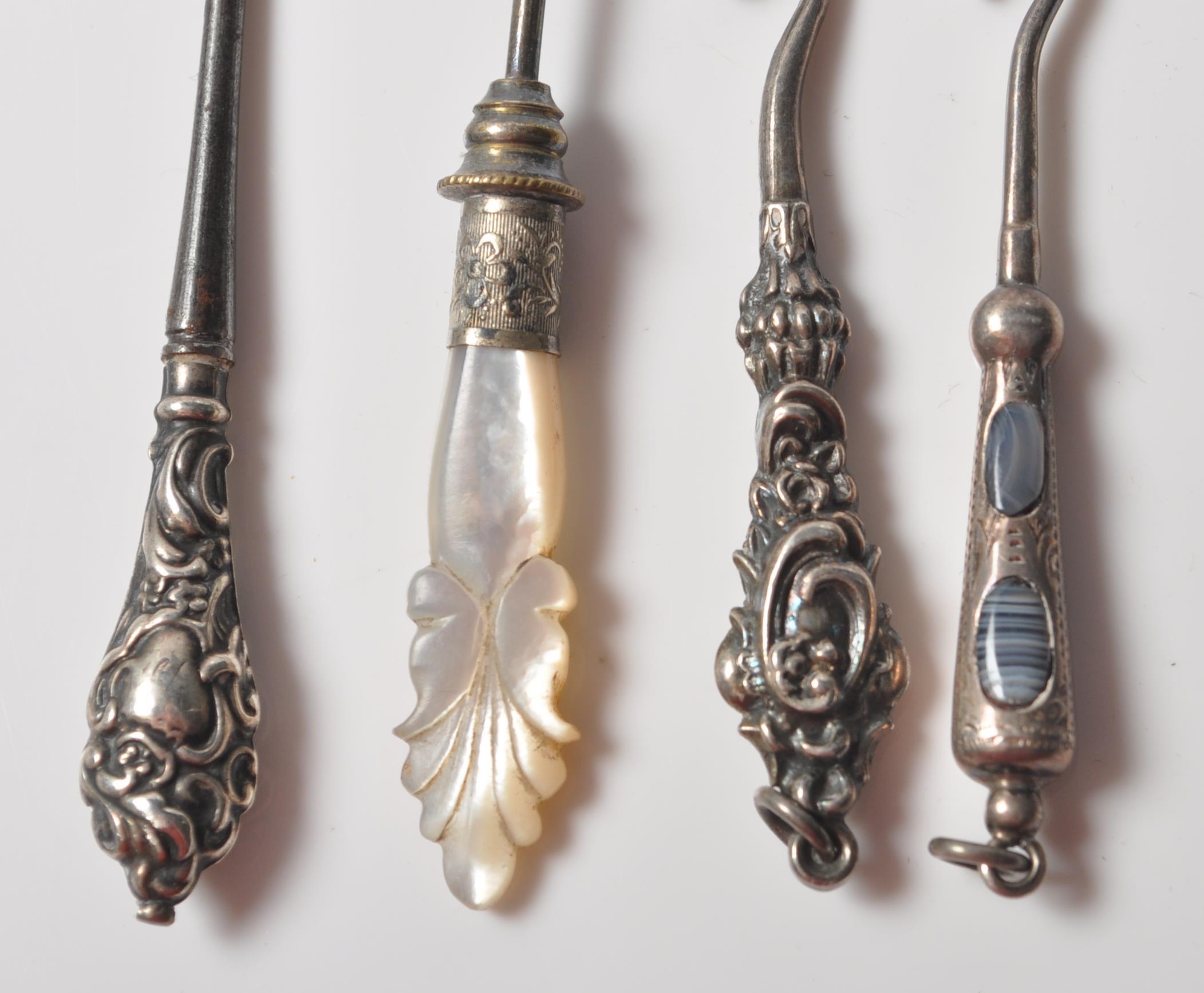 COLLECTION OF FOUR VICTORIAN SILVER BUTTON HOOKS WITH AGATE AND MOTHER OF PEARL HANDLES. - Image 3 of 8